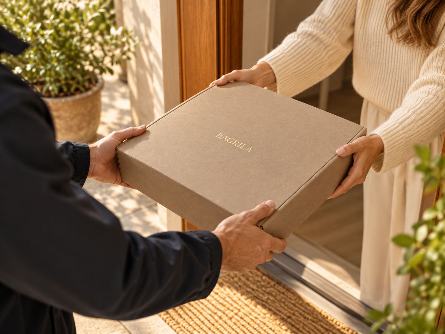 A customer handing the filled BAGRILA box back to a courier